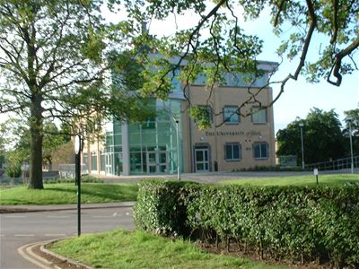 new building in the middle with a shop underneath