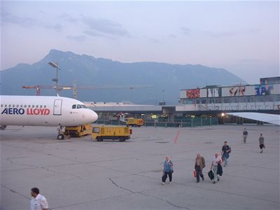 The view from the plane as people are getting on it, the Alps starting in the background