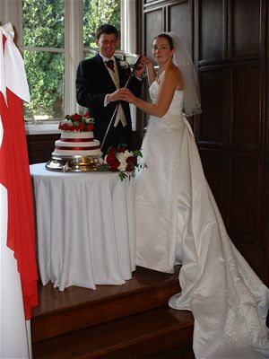 Cutting the cake with a sword