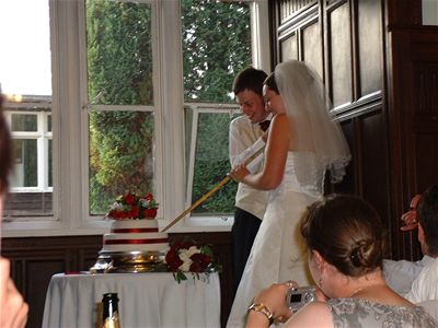 Cutting the cake with a sword