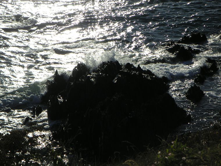 More waves smashing onto the rocks