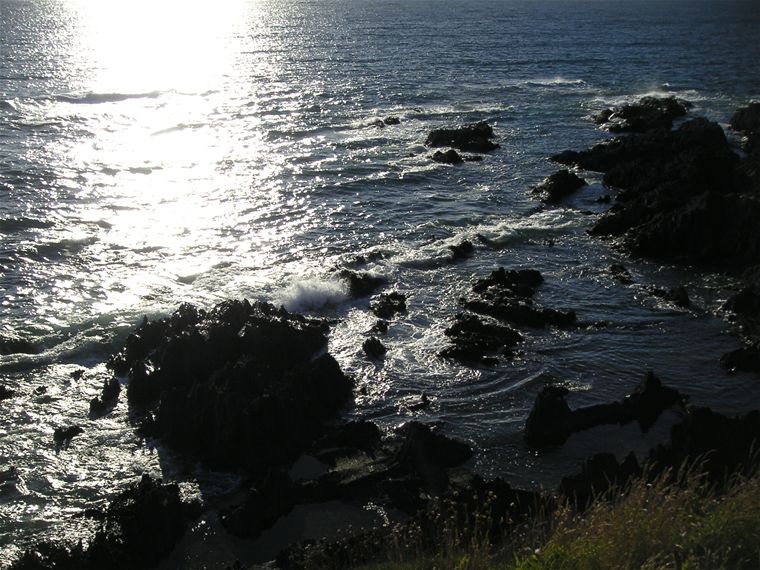 More waves smashing onto the rocks