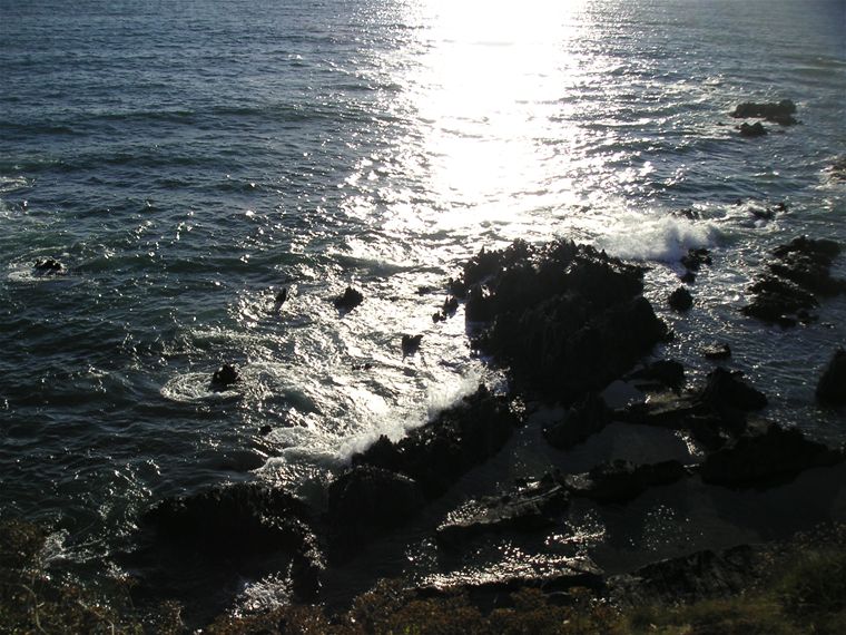 More waves smashing onto the rocks