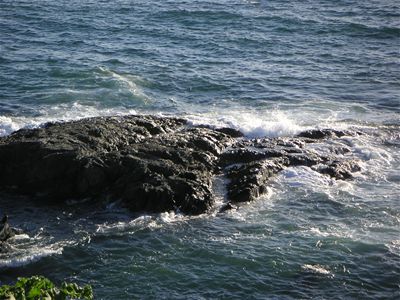 The waves smashing onto the rocks around Barricane Beach